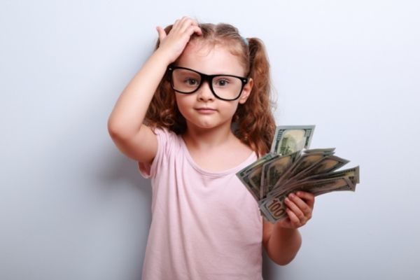 money makes for great conversation for kids: little girl with cash