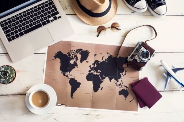 travel bucket list ideas and examples inspiration for young adults: map and computer