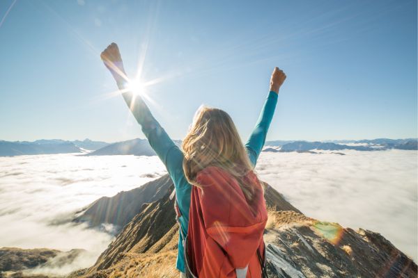 woman with hands in air