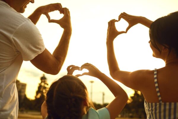 family with heart hands; positive family affirmations