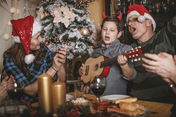 Family singing with guitar