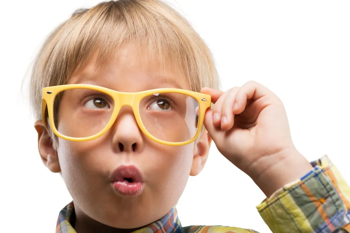 boy thinking wearing glasses