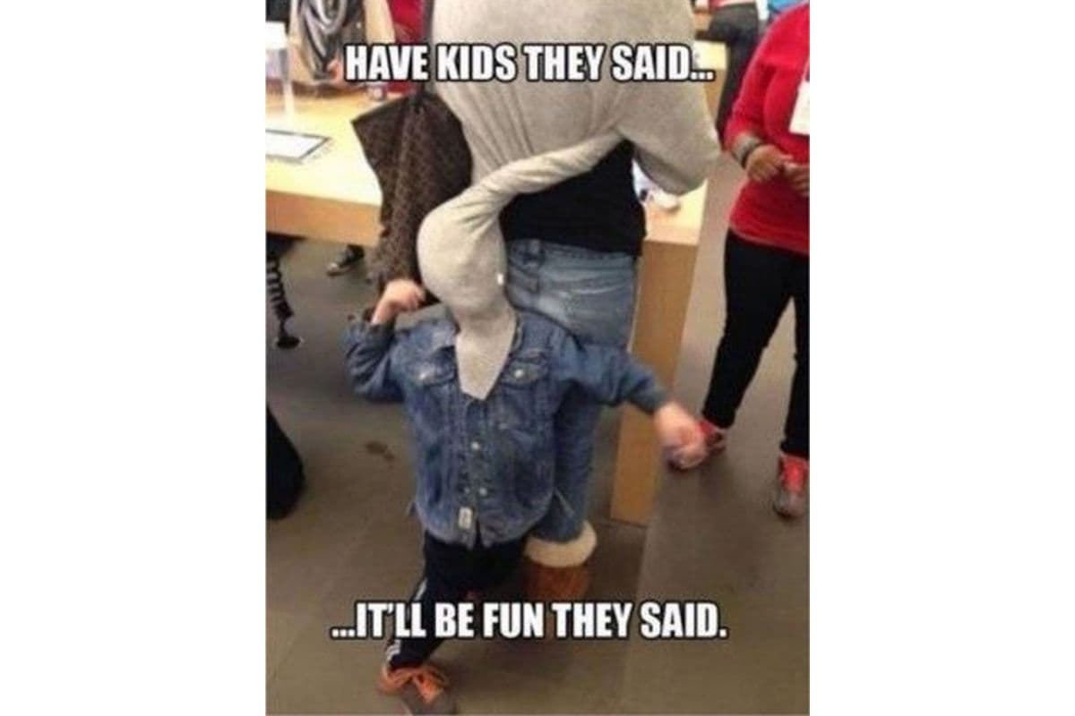 memes that sum up motherhood; child wrapped in mother's cardigan