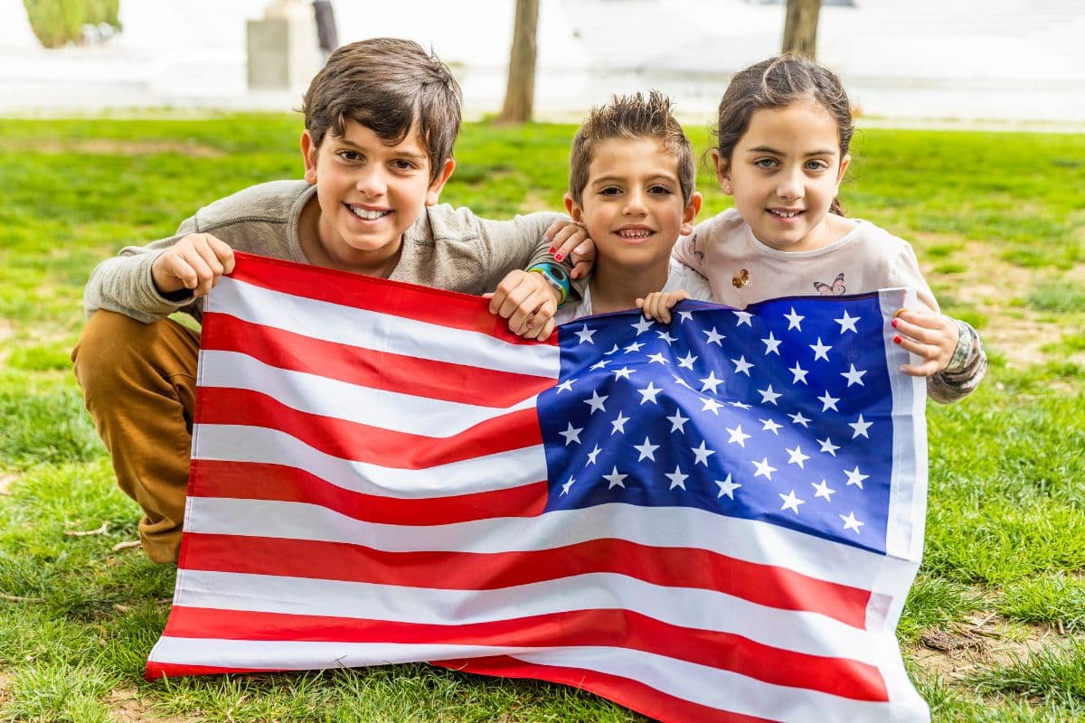 kids holding an American flag