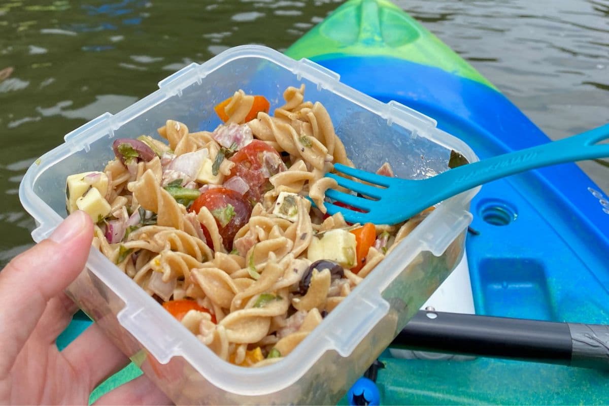 Italian pasta salad in someone's hand