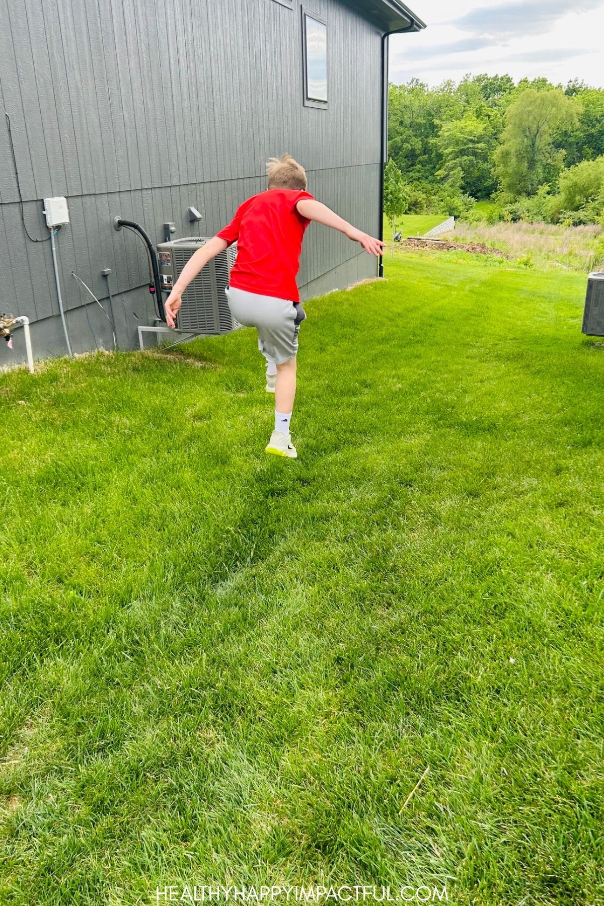 boy doing a long jump