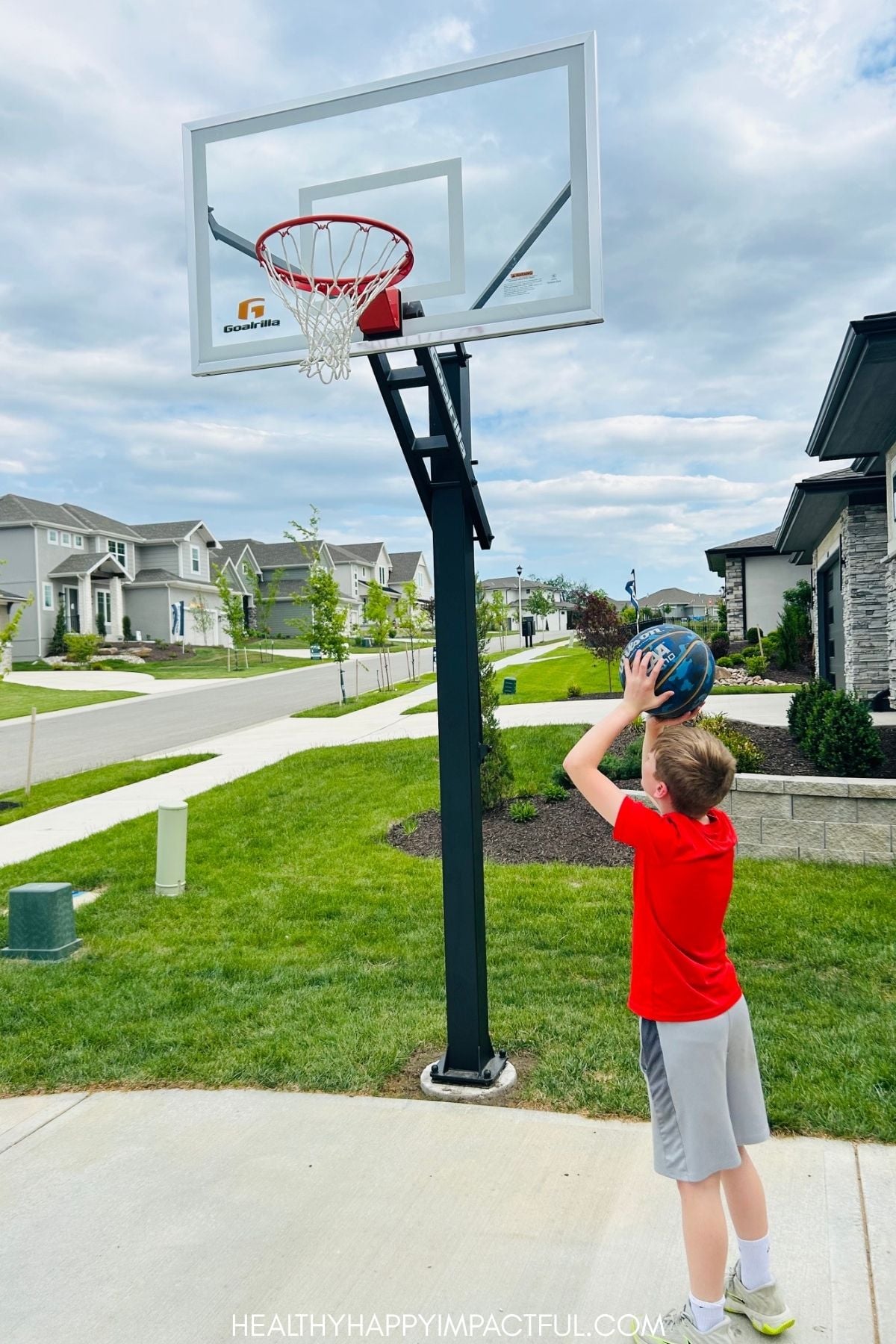 boy shooting a basket