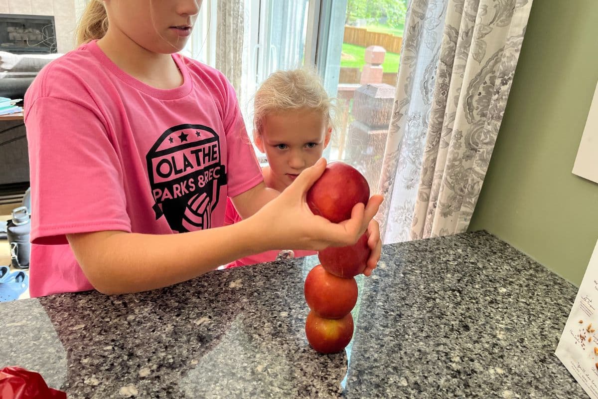 stack the apples Thanksgiving minute-to-win-it for kids