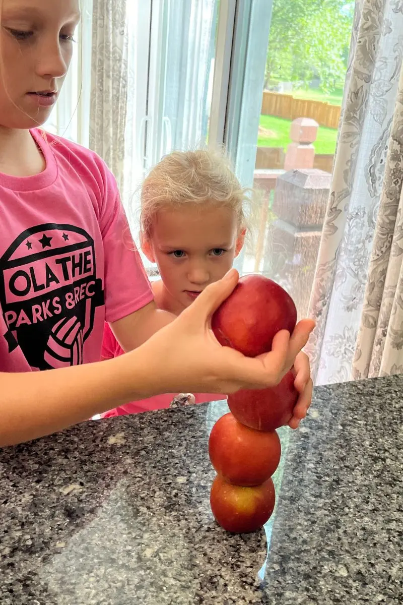 stack the apples Thanksgiving minute-to-win-it for kids