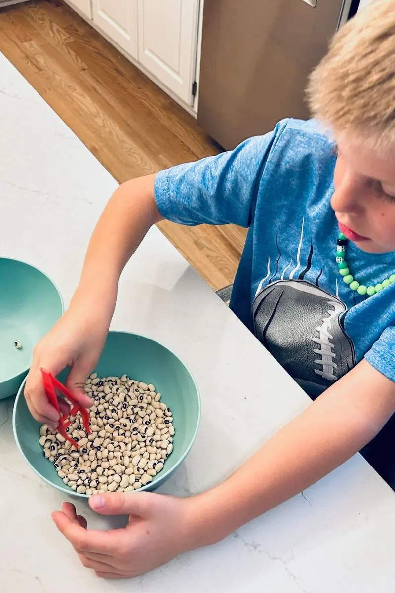 new year's eve game with tweezers and black-eyed peas