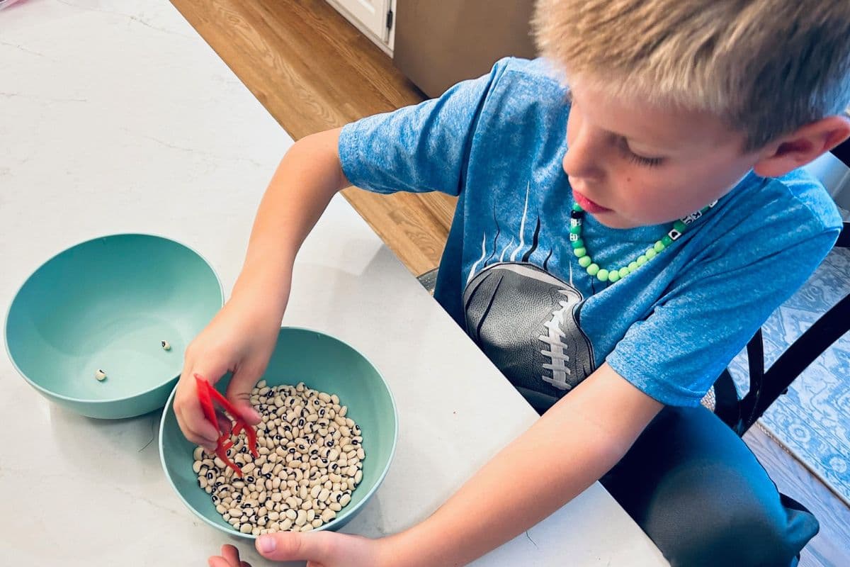 new year's eve game with tweezers and black-eyed peas