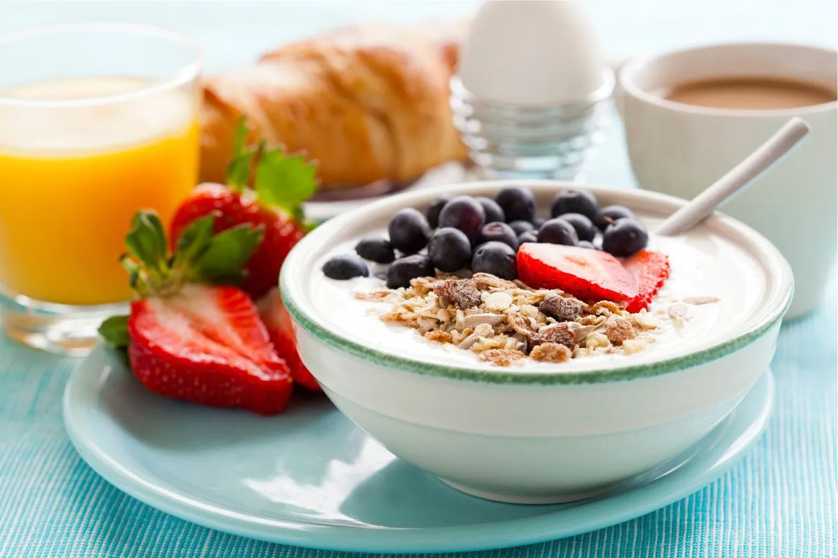 yogurt, granola, fruit in a bowl for breakfast