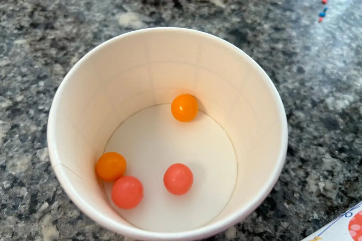 Gum ball toss into a cup