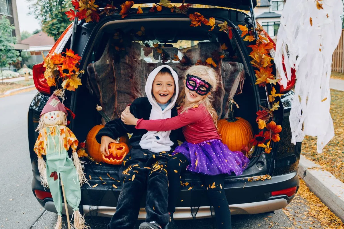 girl and boy in trunk or treat car