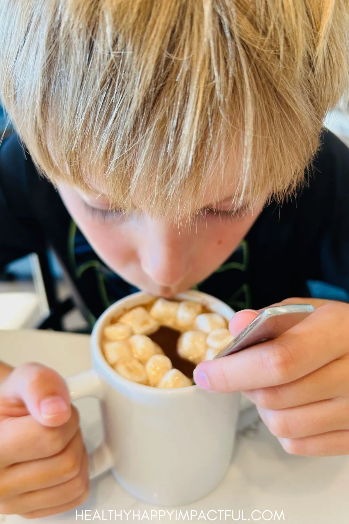 boy drinking cocoa