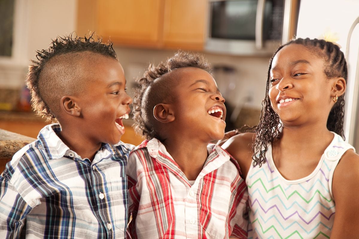 three kids laughing
