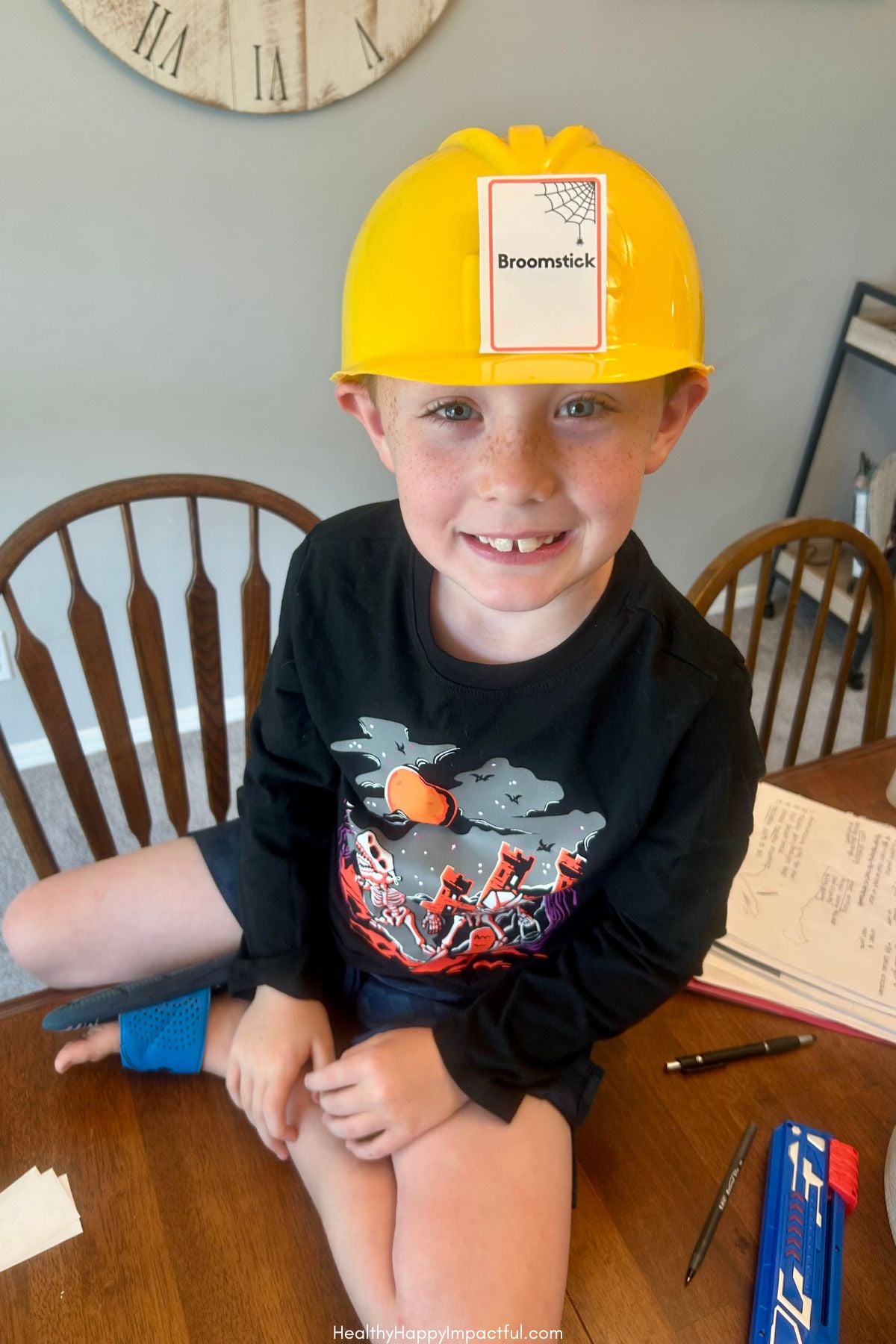 Boy playing Halloween Guess Who, Halloween Guess Who Cards For Kids