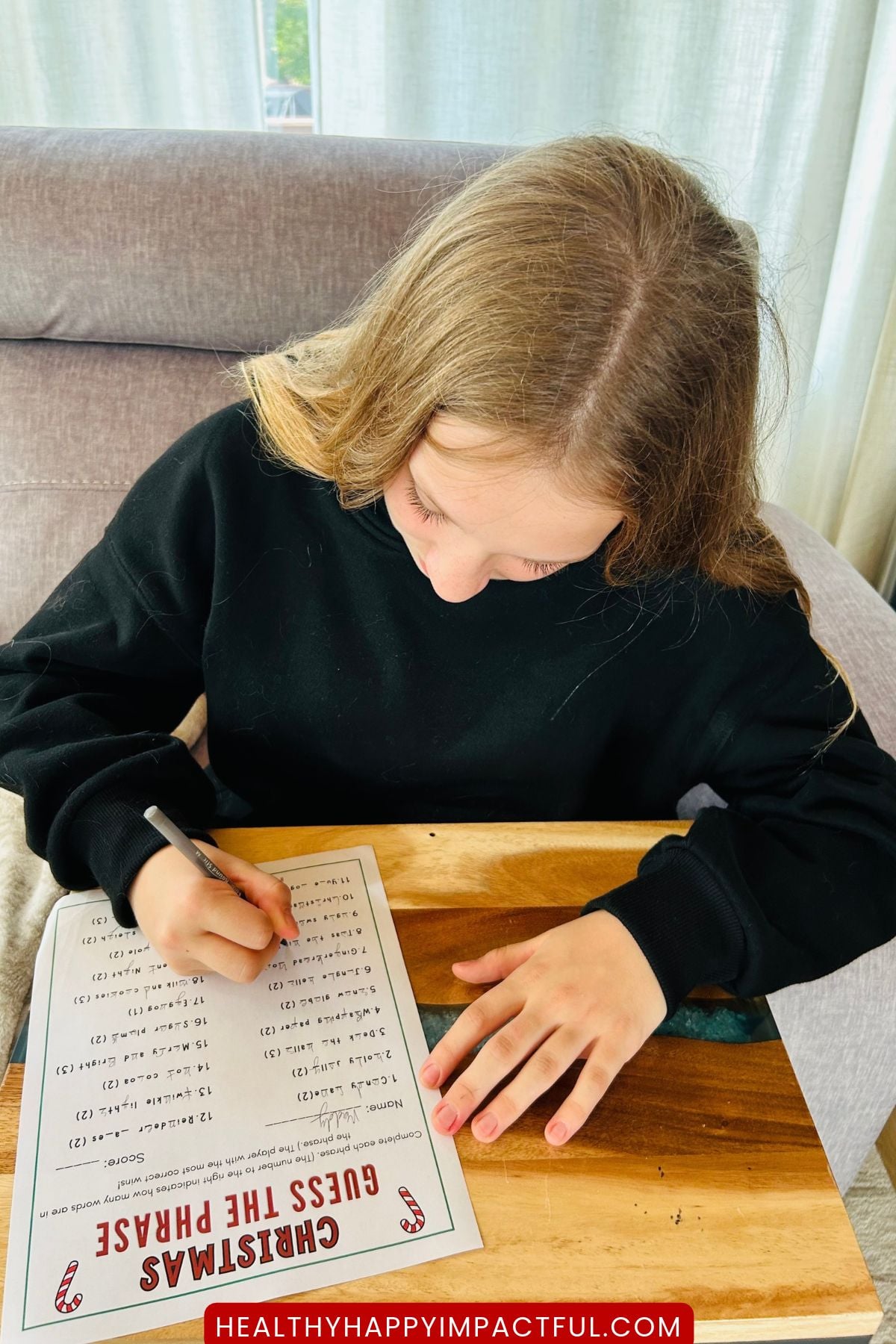 girl doing the worksheet holiday game