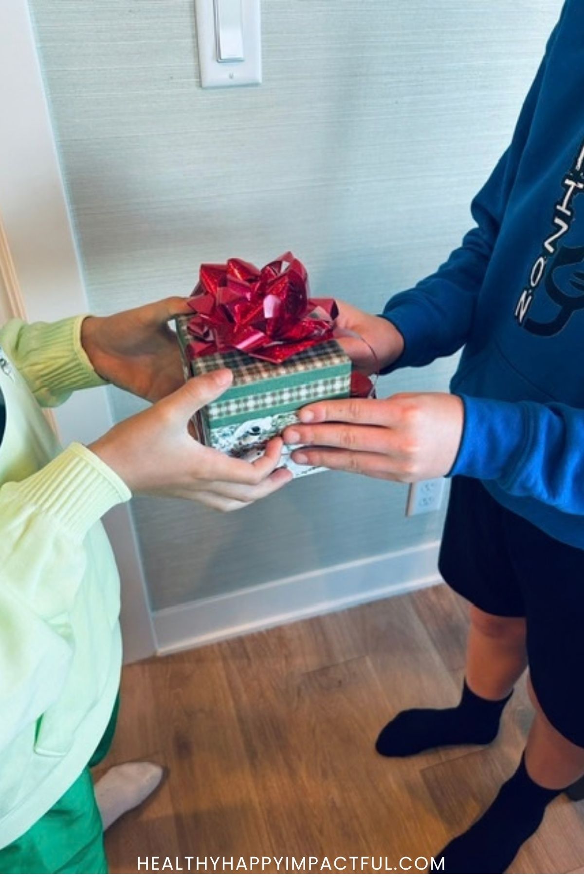 boys passing a gift